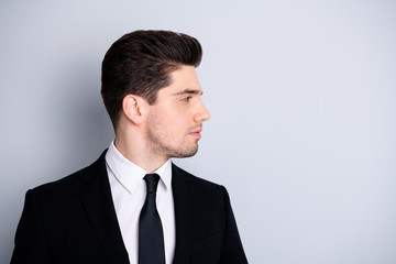Close up side profile photo amazing he him his macho attractive handsome look watch wondered empty space not smiling wear white shirt black suit jacket tie formalwear isolated bright grey background