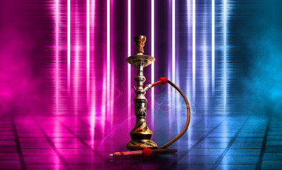 Hookah, smoke on a dark abstract background. Background of empty scenes with multicolored neon lights, reflection of night lights on wet pavement