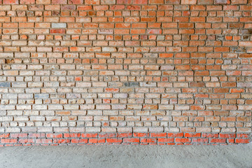 Red brick wall and stone floor background.