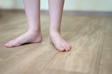 Children's feet on floor