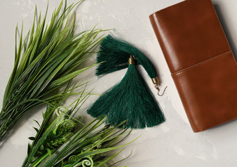 Green earrings and tufts of grass