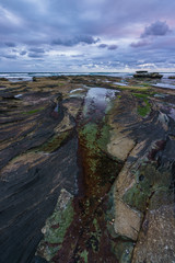 Fototapeta na wymiar Impressionen von der Felsküste bei Forresters Beach in New South Wales Australien