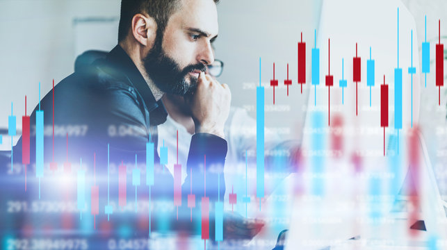 Analysts of crypro stock exchange sitting front of computer with technical price graph and indicator, red and green candlestick chart and stock trading computer screen background. Double exposure