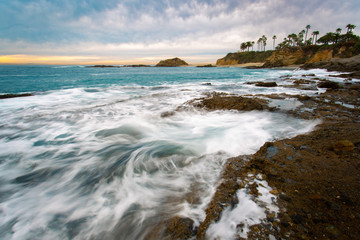 Southern California seascape of ocean waves splashing rocks and bluffs