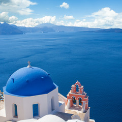 Blue and white church with bell tower in Santorini. Oia town, Greece landmark