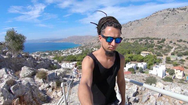 Climbing up a stairway at the beautiful island of Rhodes Greece to have an amazing view