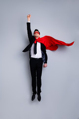 Full length body size photo jumping high he his him I save world expression costume flight up fist raised superman pose mood wear formal wear white shirt suit jacket tie isolated grey background