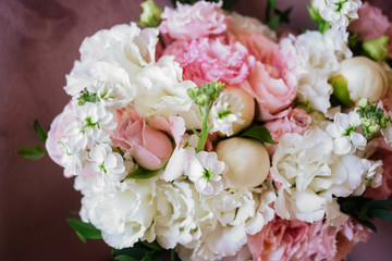 Wedding flowers, bridal bouquet closeup. Decoration made of roses, peonies and decorative plants, close-up, selective focus, nobody, objects