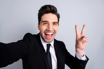 Close up photo amazing funky he him his model macho handsome make take selfies show v-sign say hi colleagues coworkers wear white shirt black suit jacket tie formalwear isolated grey background