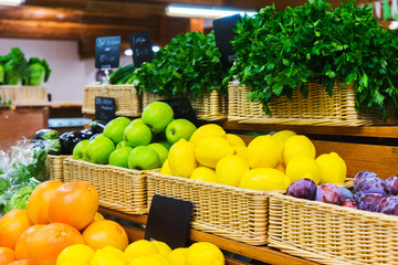 Fresh fruits on the wooden counter of a small farm market. 