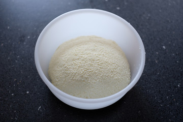 Freshly made ricotta cheese in a container