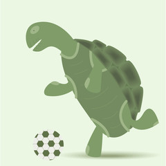 cheerful little turtle runs and kicks a soccer ball
