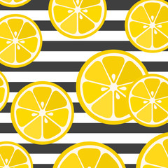 Cute yellow lemon slices on striped grey and blue background. Great for print on fabric and children clothes.