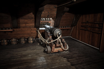 interior view of Cannons At The Deck and Cannon Balls plus windows on old galleon with rope
