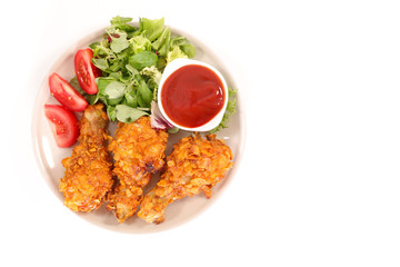 crispy chicken leg with salad and ketchup