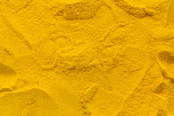 Turmeric powder texture background pattern