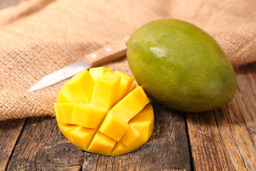 fresh mango with wood background