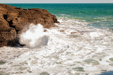 waves crashing on rocks