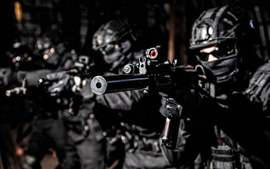 Fototapeta na wymiar Police SWAT team suppresses criminals with gunfire
