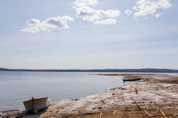The spring river waiting for a high water in a midland of Russia in the clear sunny day.