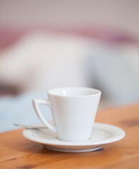 White cup on the table at home