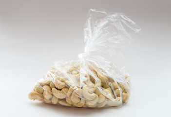 Cashew nuts in a package on white.