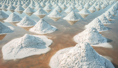 Brine salt farm at Samut Sakhon, Thailand. Organic sea salt. Evaporation and crystallization of sea water. Raw material of salt industrial. Sodium Chloride. Solar evaporation system. Iodine source.