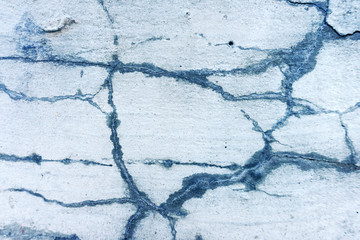 abstract concrete background closeup, grey light cracked