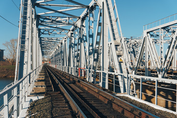 Fototapeta na wymiar railway bridge over the river in summer weather