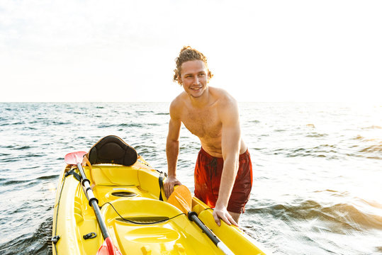 Healthy Strong Man Kayaking