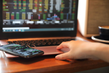 Fototapeta premium Woman hand working at coffee shop hand on keyboard with close up