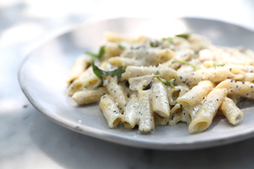 Penne pasta with white sauce and truffle , italian food