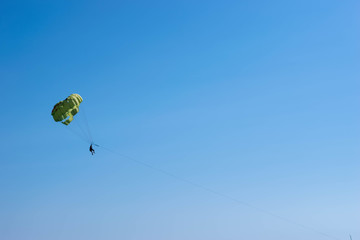 Parachute tied to a high-speed boat at sea 