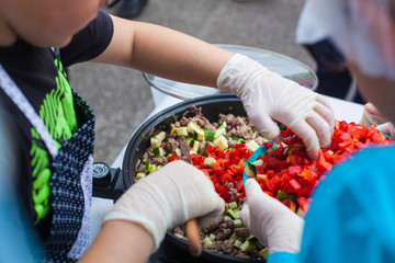 Putting vegetables in a pan
