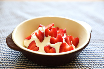 Strawberry with cream on table dessert