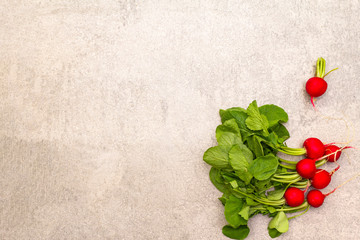 Fresh organic radish. Food cooking stone background. Healthy vegetarian (vegan) eating concept, top view, copy space, flat lay.
