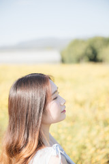 Portrait of Young Asian woman girl smile in flower garden