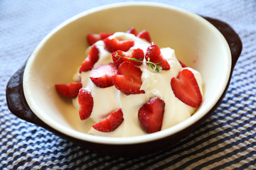 Strawberry with cream on table dessert