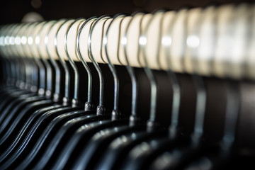 Clothes hangers in a wardrobe.