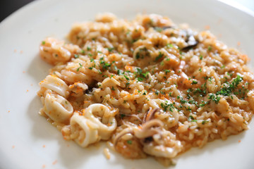 Seafood Risotto , traditional italian rice on table