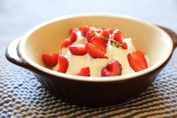 Strawberry with cream on table dessert