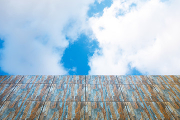 Blue sky white cloud with seamless Modern tiles texture foreground.