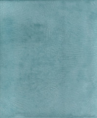 Tadelakt sample, lime coating écologic and natural. Turquoise texture background.