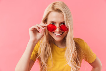 Smiling blonde woman in sunglasses looking at the camera