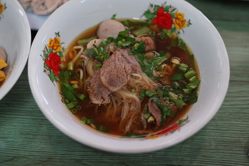 thai noodle soup with meat and vegetables