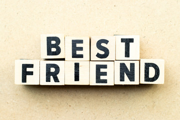 Letter block in word best friend on wood background
