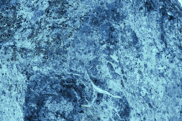 Fototapeta na wymiar Vintage blue background. Rough painted wall of sapphire color. Imperfect plane of blue colored. Uneven old decorative toned backdrop of cyan tint. Texture of sapphirine hue. Ornamental stony surface.