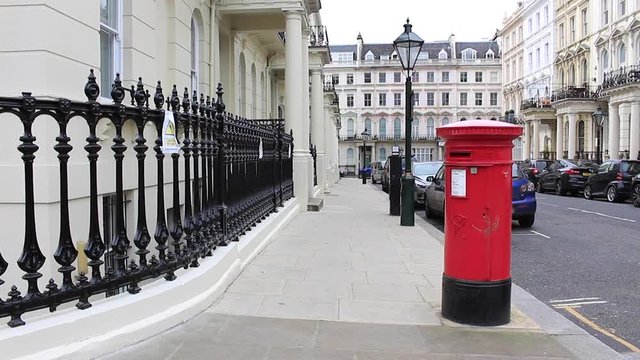 Red post box in the heart of London (Kensington), England