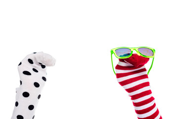 cropped view of person with colorful sock puppets and sunglasses on hands Isolated On White