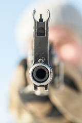 Kalashnikov rifle front view gun point. Direct machine gun close-up
